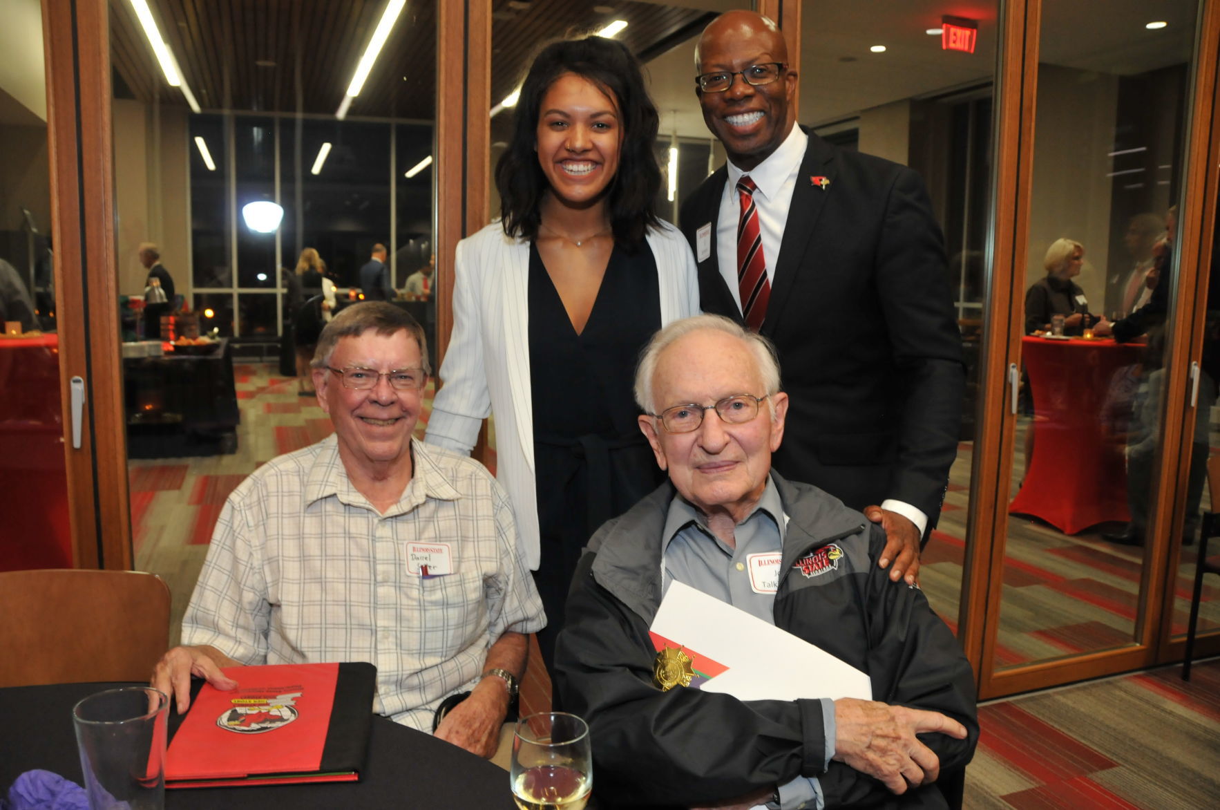 Seated: Darrel Sutter, Joe Talkington with Radiance Campbell, LJ Johnson